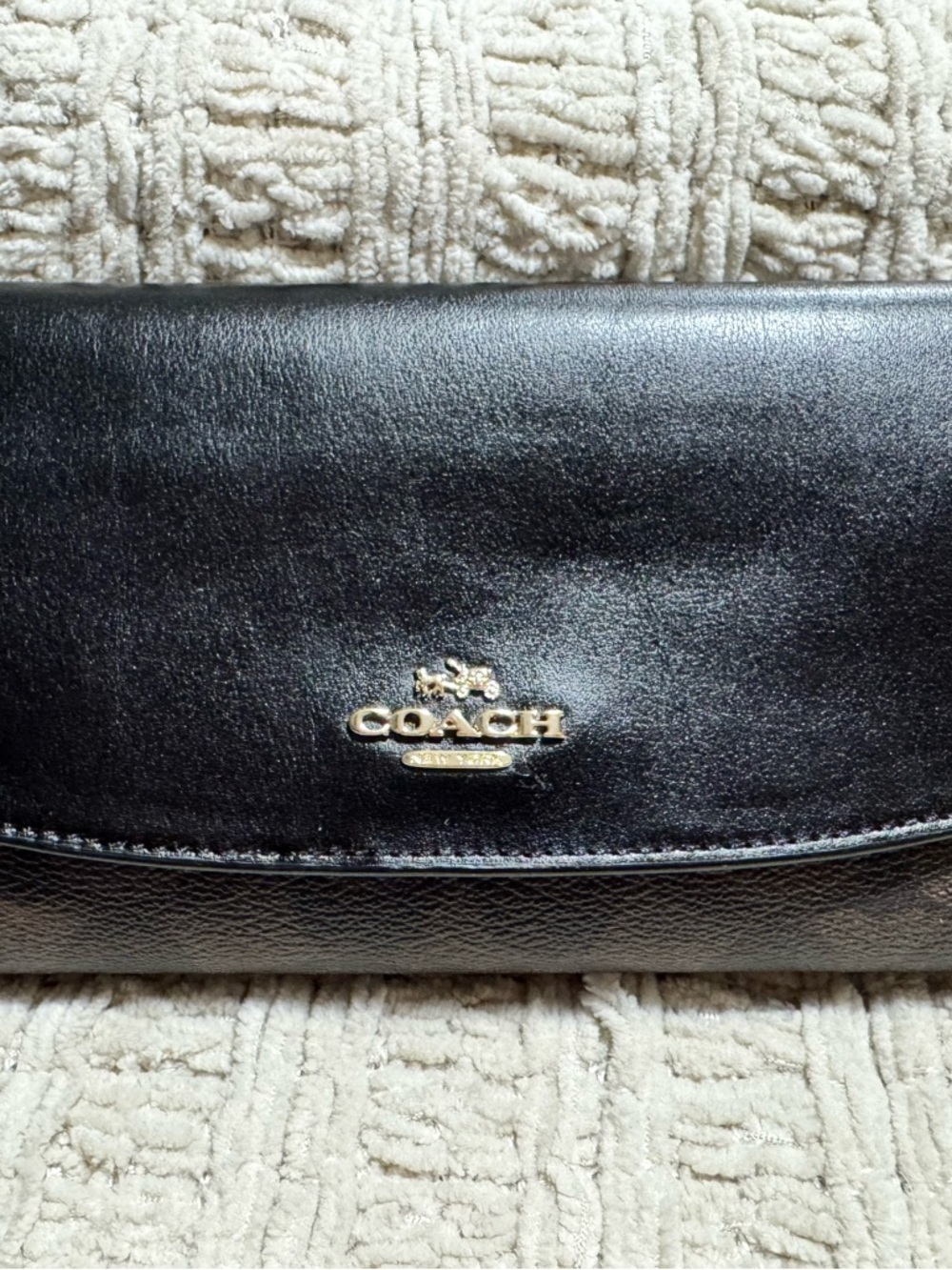 COACH Signature Trifold Wallet with Checkbook cover.